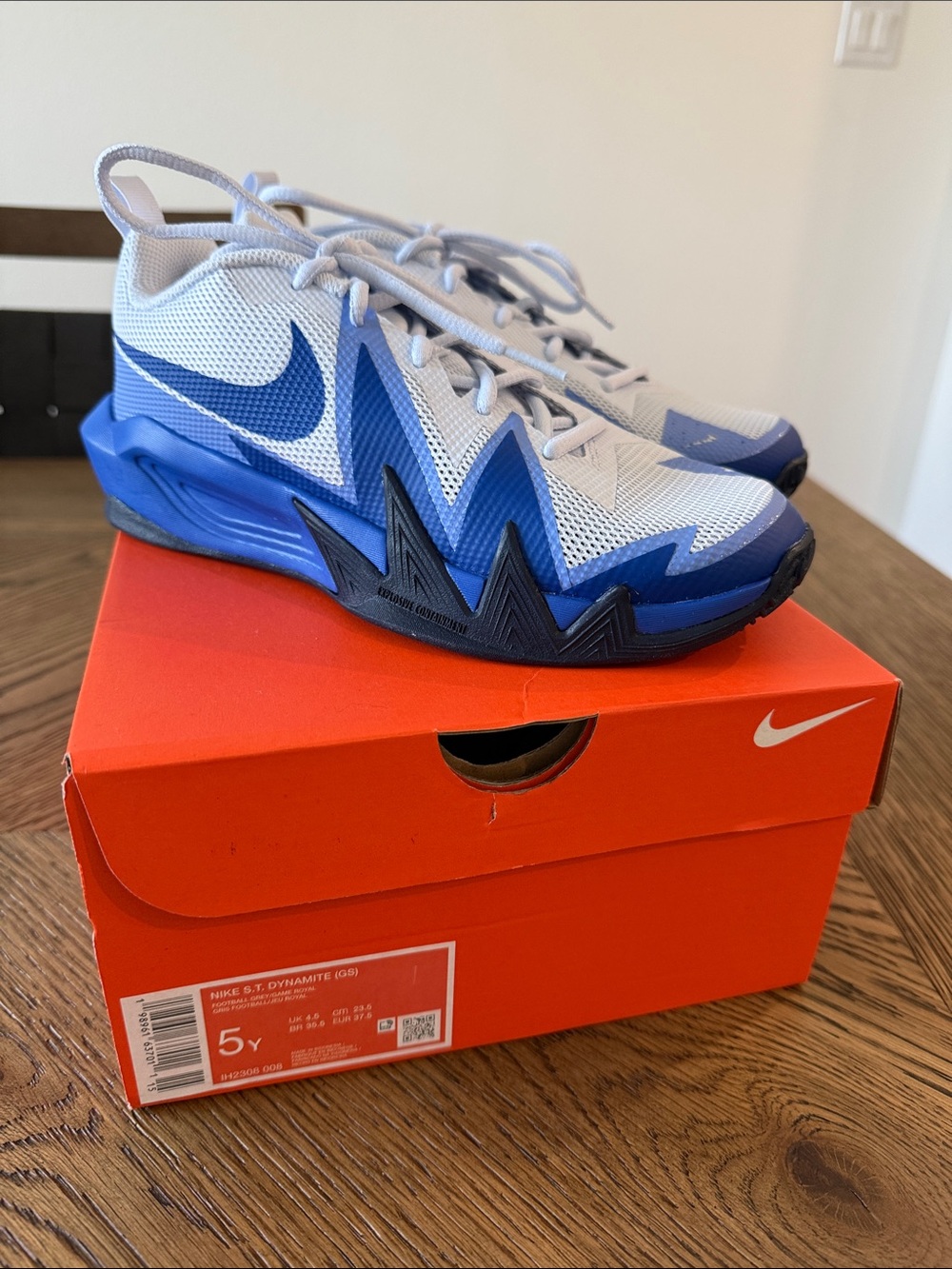 Boy’s Big Kids grey, black and Blue Nike shoes